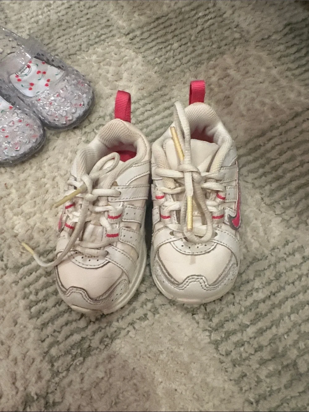 Nike Kids White Sneakers with Pink Swoosh and Accents